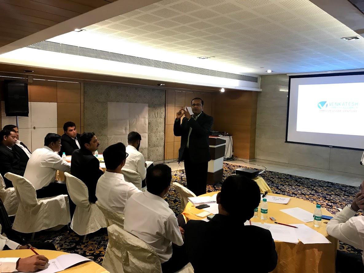 Dr. Sanjay Runwal conducting a training session